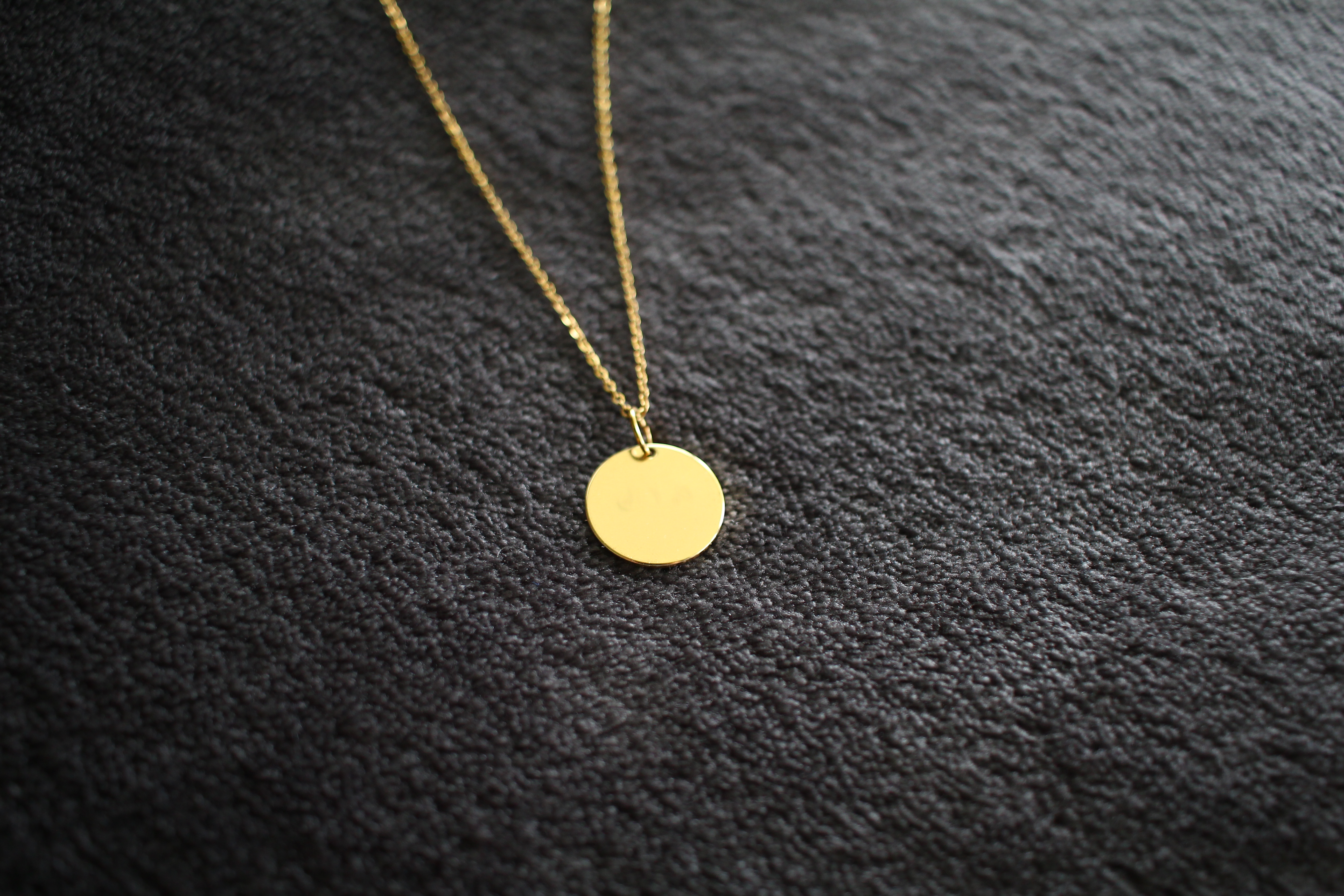 Gold necklace with blank pendant